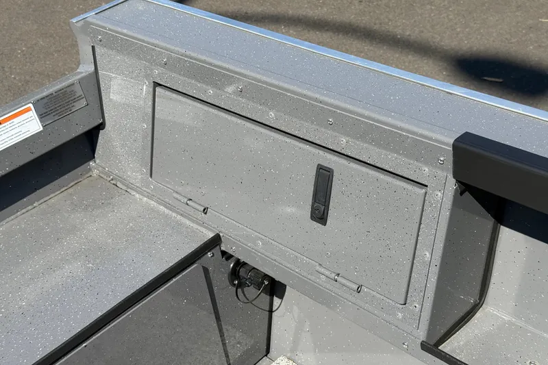 Slide: The Image of 2026 Alumaweld Free Drifter 20 boat interior with storage compartment and speckled finish. - 25