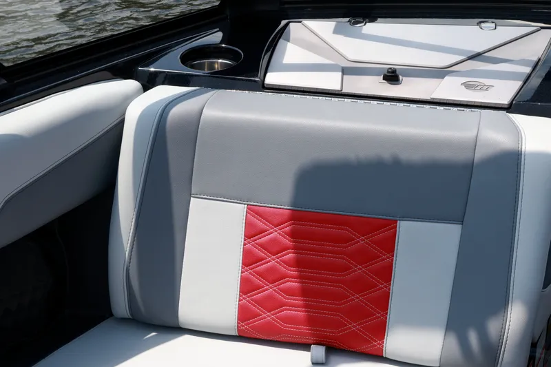 Slide: The Image of 2023 Malibu Wakesetter 25 LSV interior with red and gray seating detail. - 12