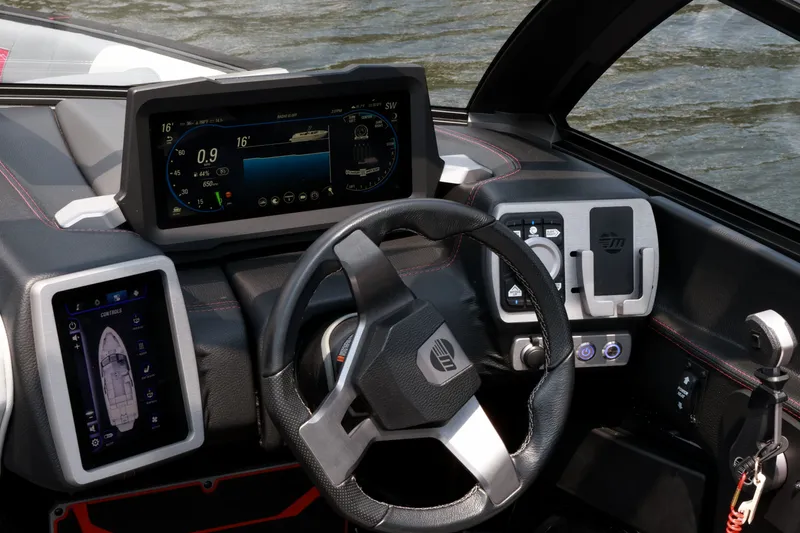 Slide: The Image of 2023 Malibu Wakesetter 25 LSV dashboard with advanced digital controls and steering wheel. - 13