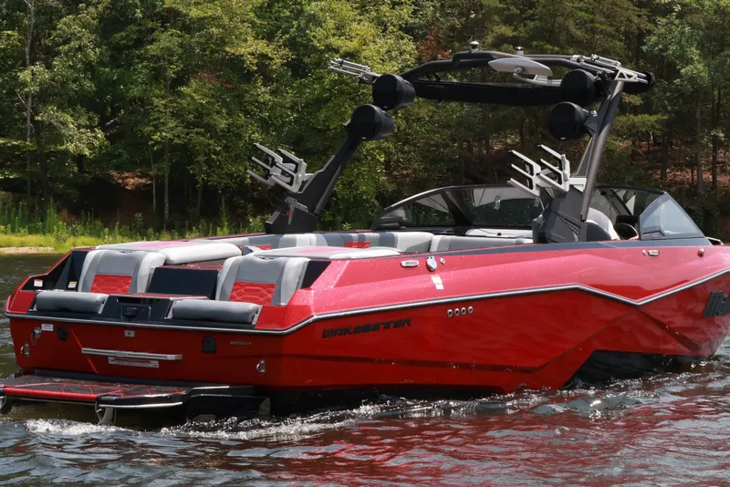 Slide: The Image of 2023 Malibu Wakesetter 25 LSV in vibrant red on a serene lake. - 6