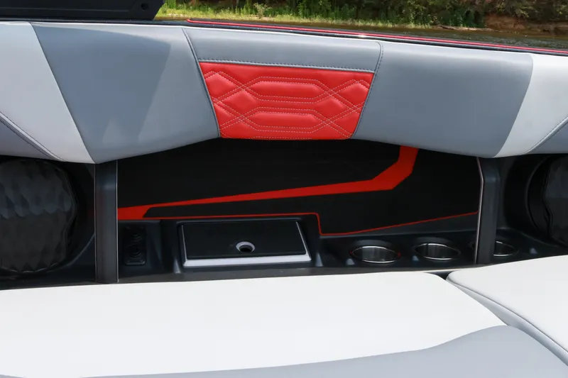 Slide: The Image of Interior of 2023 Malibu Wakesetter 25 LSV with stylish red and gray seating. - 17