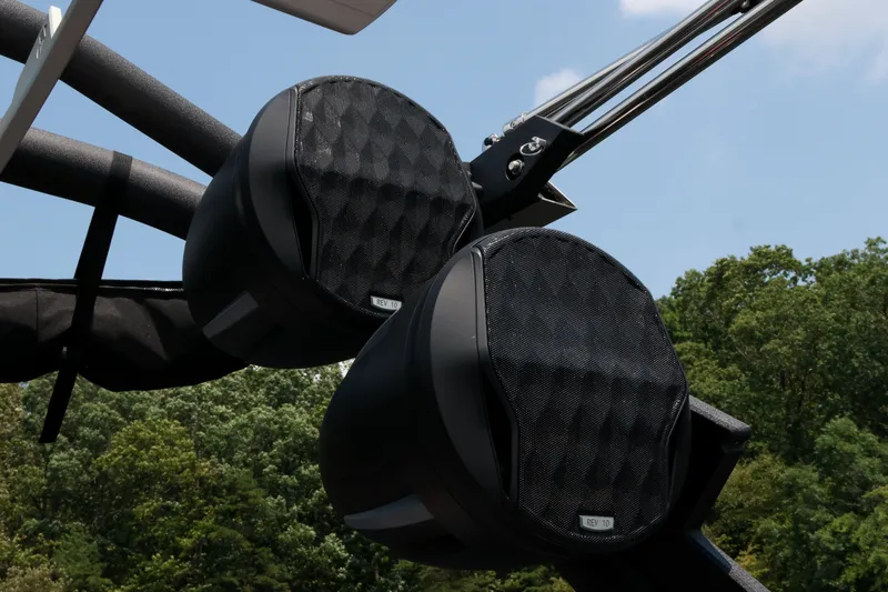 Slide: The Image of 2023 Malibu Wakesetter 25 LSV speakers against a clear sky and forest backdrop. - 19