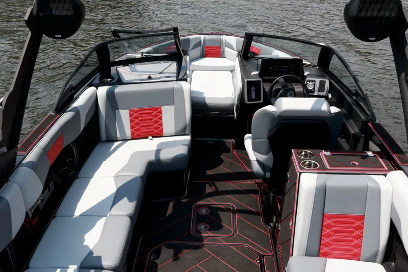 Slide: The Image of 2023 Malibu Wakesetter 25 LSV interior with sleek seating and modern dashboard design. - 11