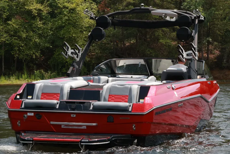 Slide: The Image of 2023 Malibu Wakesetter 25 LSV boat on water, featuring sleek red design and modern amenities. - 5