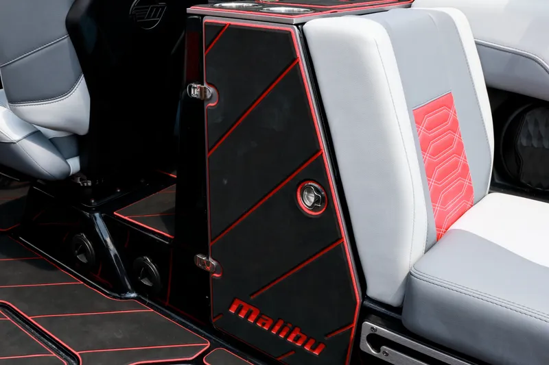 Slide: The Image of 2023 Malibu Wakesetter 25 LSV interior with sleek black and red design accents. - 18