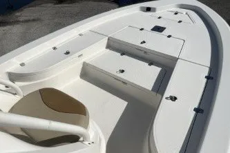 Slide: The Image of 2023 NauticStar 227 XTS boat deck with seating and storage compartments. - 10