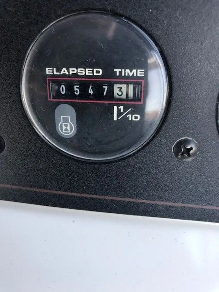 Slide: The Image of Close-up of an hour meter showing 547.3 hours on a 1989 Carver 3067 Santego. - 4