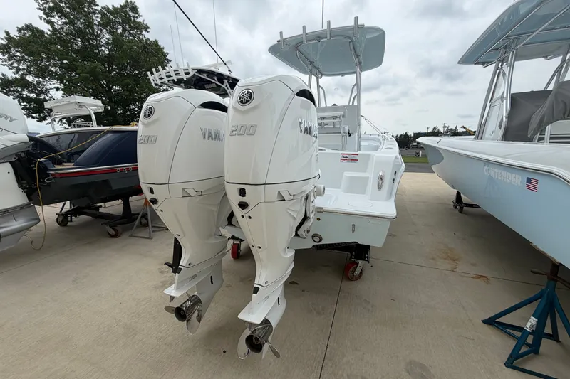 Slide: The Image of 2027 Contender 24 Sport boat with dual Yamaha 200 engines on display. - 3