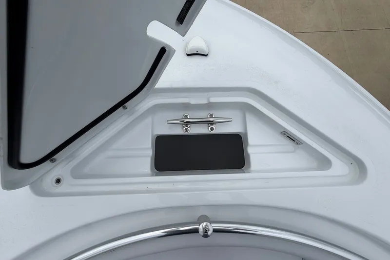 Slide: The Image of Open storage compartment on 2027 Contender 24 Sport boat deck. - 4