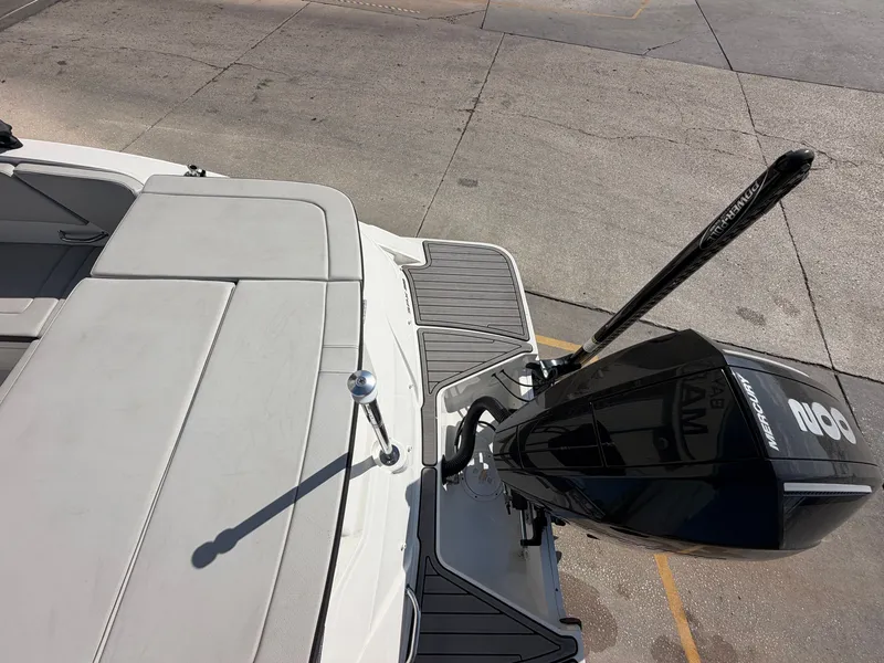 Slide: The Image of The image shows the stern of a 2022 Sea Ray SPX 230 Outboard boat with an outboard motor. - 16
