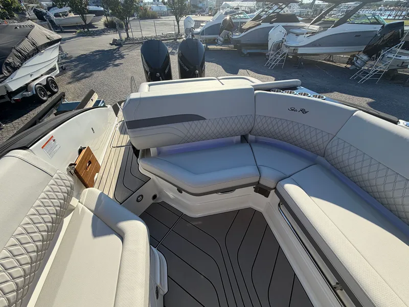 Slide: The Image of The image shows the cockpit of a Sea Ray SLX 280 Outboard with sleek, upholstered seating. - 13