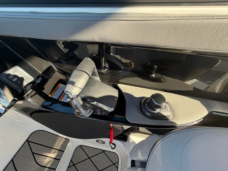 Slide: The Image of Close-up of a Sea Ray SLX 280 Outboard helm with modern controls. - 35