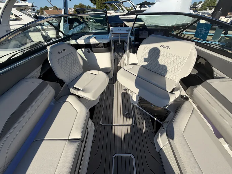 Slide: The Image of Interior view of a Sea Ray SLX 280 Outboard with sleek, upholstered seating and modern design. - 28