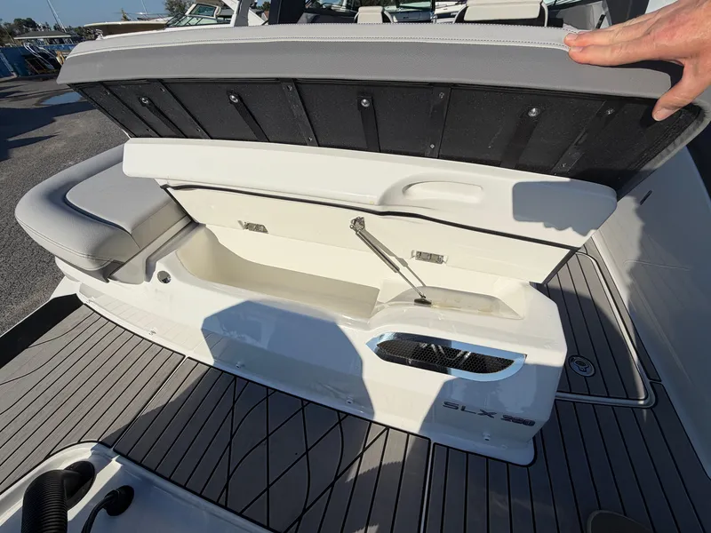 Slide: The Image of The 2027 Sea Ray SLX 280 Outboard features an open bench seat with storage underneath. - 9