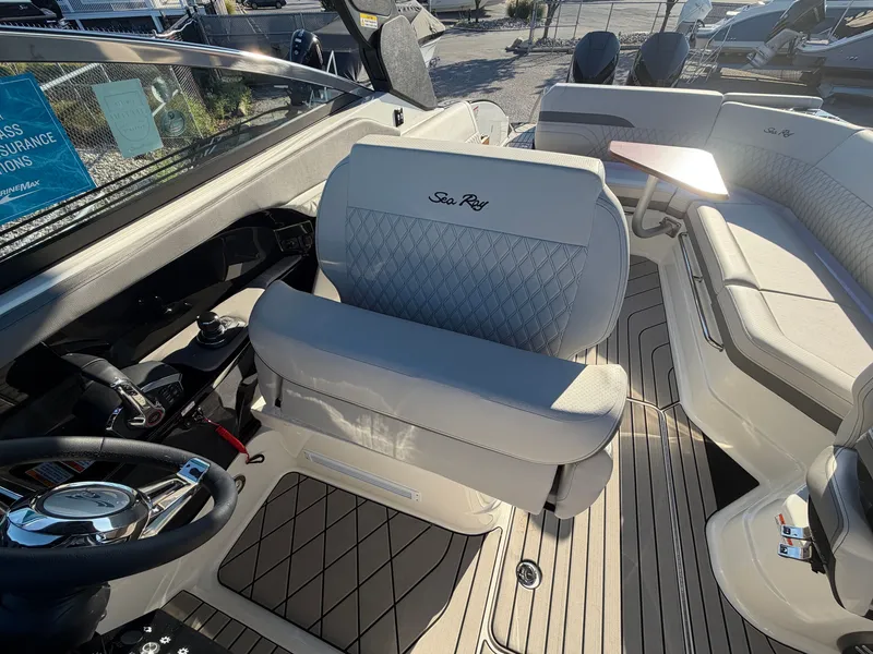 Slide: The Image of The image shows the cockpit of a Sea Ray SLX 280 Outboard with sleek seating and modern design. - 26
