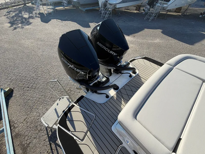 Slide: The Image of Two Mercury outboard engines on a Sea Ray SLX 280 boat, positioned on a dry dock. - 7