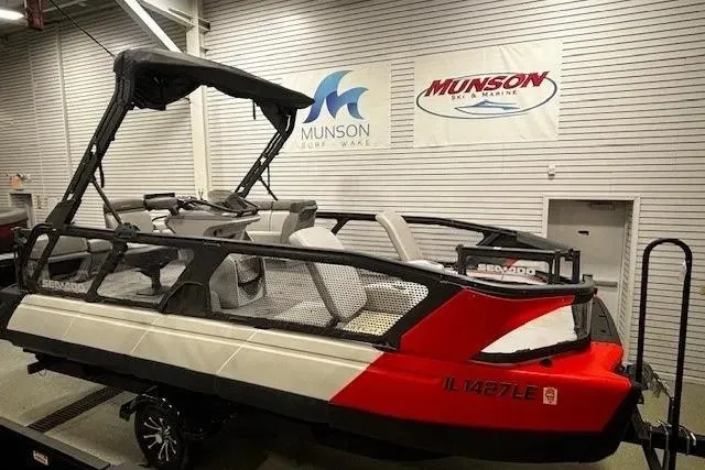 Slide: The Image of 2022 Sea-Doo Switch Cruise 21 pontoon boat displayed indoors at Munson Marine. - 2