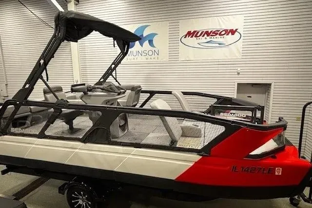 Slide: The Image of 2022 Sea-Doo Switch Cruise 21 pontoon boat displayed indoors at Munson Marine. - 0
