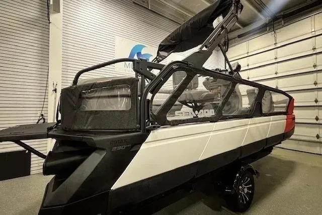 Slide: The Image of 2022 Sea-Doo Switch Cruise 21 pontoon boat in a showroom setting. - 6