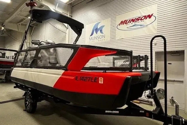 Slide: The Image of 2022 Sea-Doo Switch Cruise 21 pontoon boat displayed indoors at Munson Marine. - 3