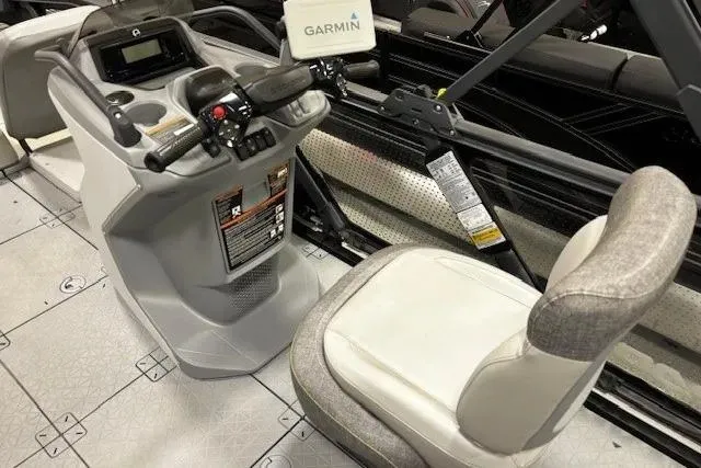 Slide: The Image of 2022 Sea-Doo Switch Cruise 21 dashboard with Garmin navigation and comfortable seating. - 5