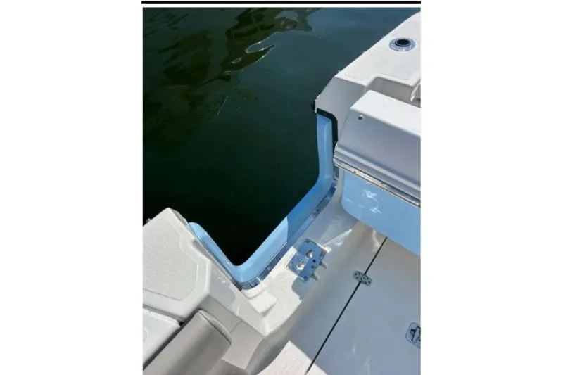 Slide: The Image of 2023 Pursuit S 378 Sport boat deck with open transom door. - 18