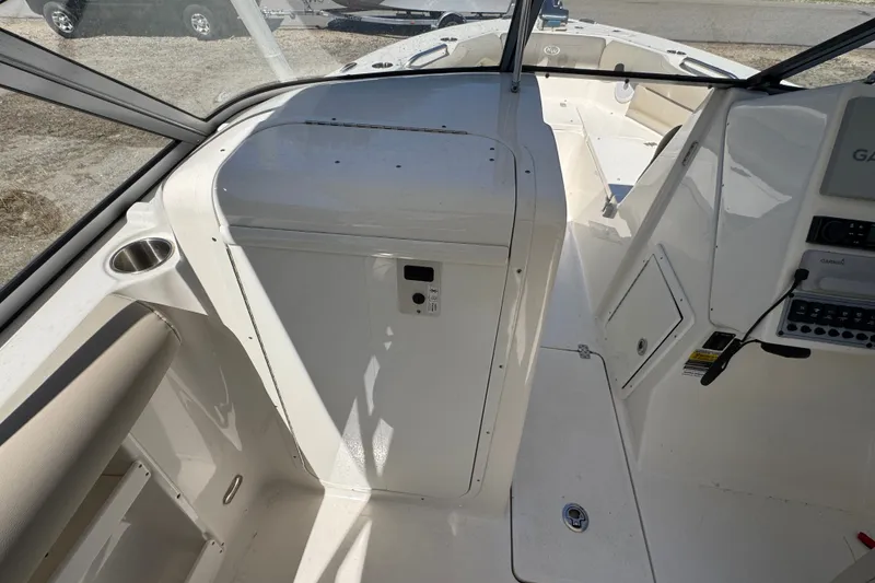 Slide: The Image of Interior view of 2023 Key West 239 DFS boat, featuring helm and seating area. - 8