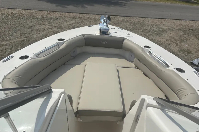Slide: The Image of 2023 Key West 239 DFS boat with spacious bow seating and beige cushions. - 33