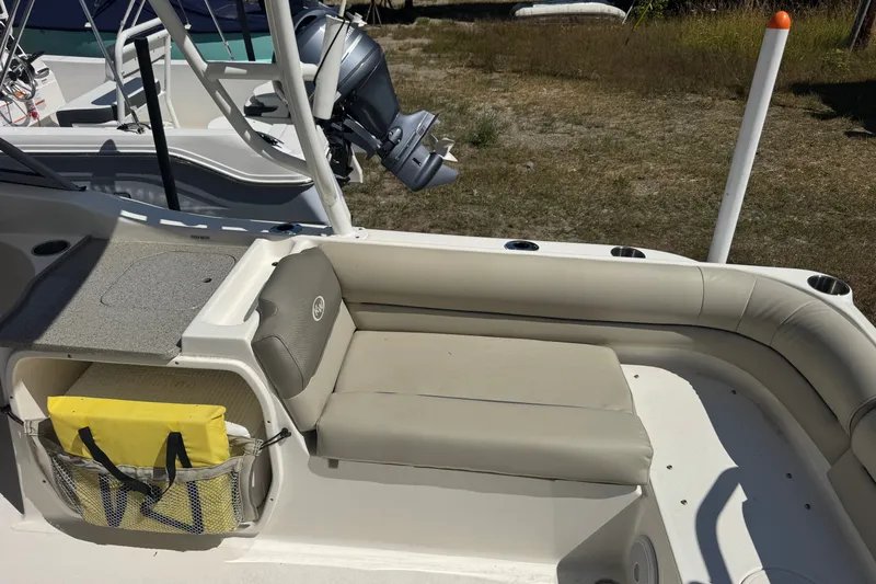 Slide: The Image of 2023 Key West 239 DFS boat interior with seating and storage compartment. - 3