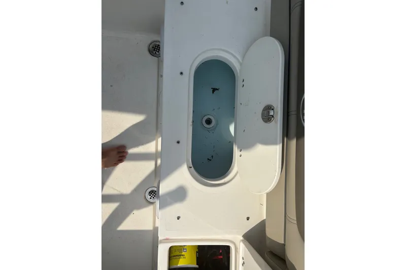 Slide: The Image of 2023 Key West 239 DFS boat interior with open storage compartment. - 41