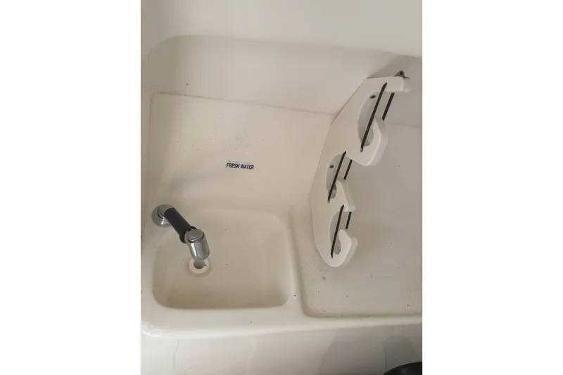 Slide: The Image of Freshwater sink and cup holders on 2023 Key West 239 DFS boat. - 51