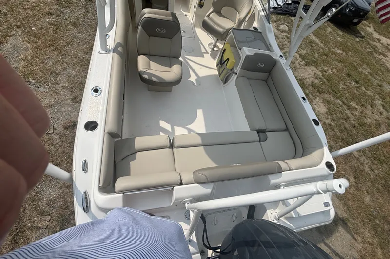 Slide: The Image of 2023 Key West 239 DFS boat interior with beige seating and spacious layout. - 15