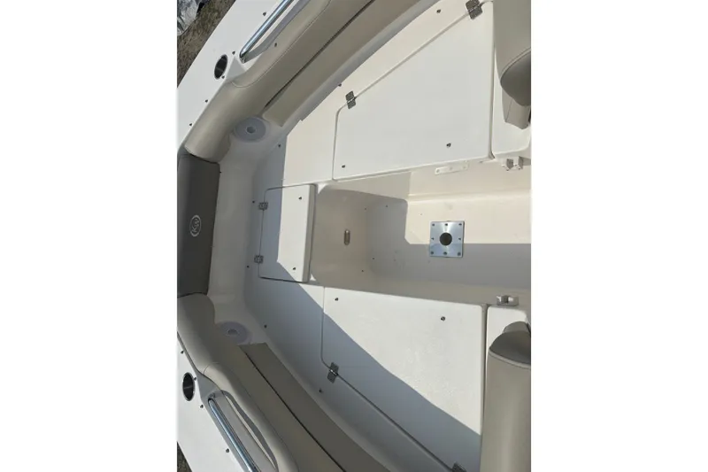 Slide: The Image of 2023 Key West 239 DFS boat interior with seating and storage compartments. - 45