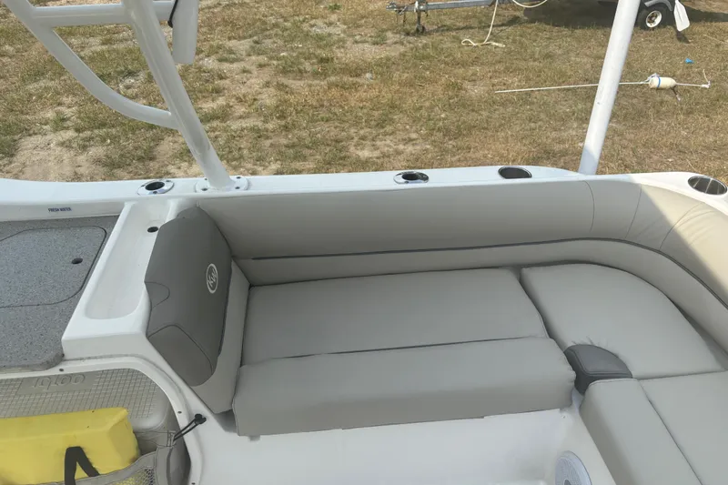 Slide: The Image of 2023 Key West 239 DFS boat interior with gray seating and cup holders. - 26