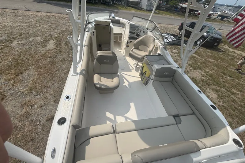 Slide: The Image of 2023 Key West 239 DFS boat interior with spacious seating and modern design. - 16