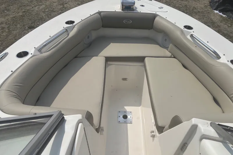 Slide: The Image of 2023 Key West 239 DFS boat interior with beige seating and cup holders. - 37