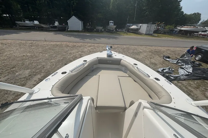 Slide: The Image of 2023 Key West 239 DFS boat with spacious seating, parked outdoors. - 35