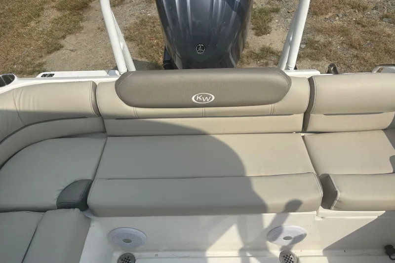 Slide: The Image of 2023 Key West 239 DFS boat with beige seating and KW logo. - 27