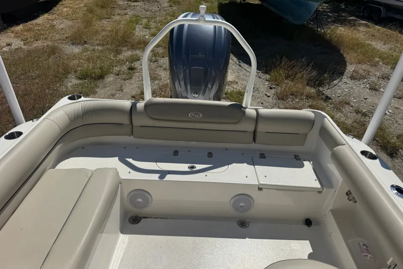 Slide: The Image of 2023 Key West 239 DFS boat interior with seating and storage compartments. - 2