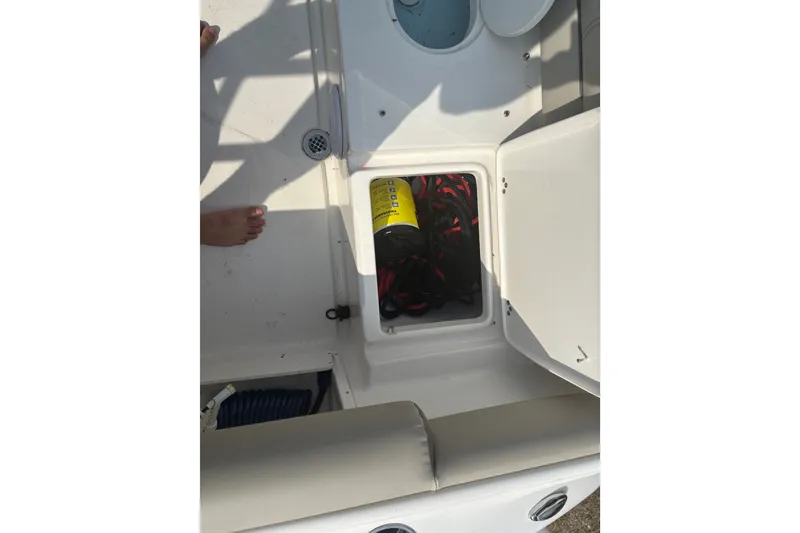Slide: The Image of 2023 Key West 239 DFS boat storage compartment with safety equipment. - 42