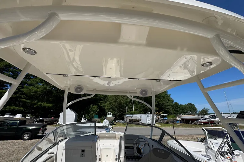 Slide: The Image of 2023 Key West 239 DFS boat interior with canopy and steering console. - 13