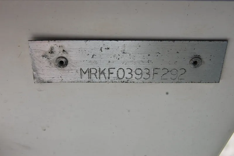 Slide: The Image of Metal plate with serial number MRKF0393F292 on a 1992 Mako 221 Center Console. - 13