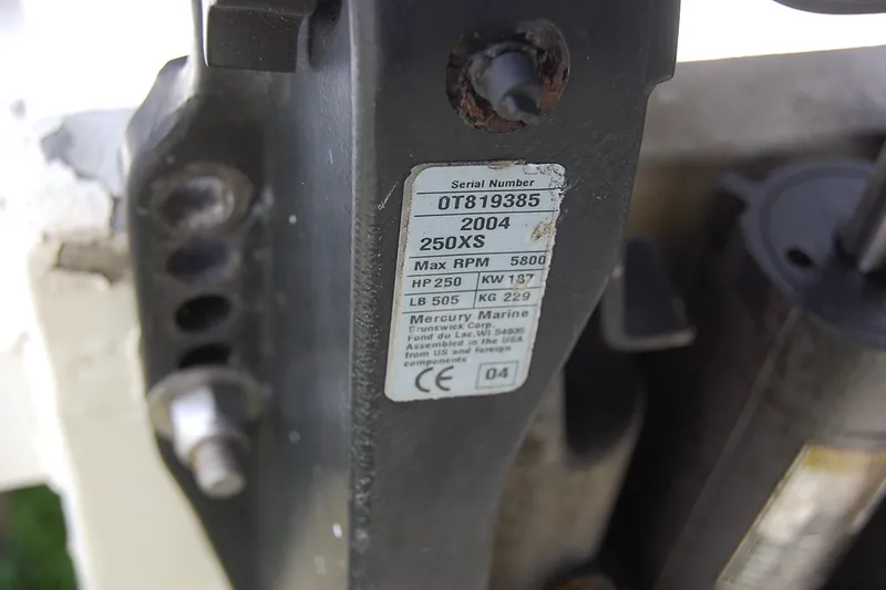 Slide: The Image of Close-up of a Mercury Marine engine label on a 1992 Mako 221 Center Console. - 12