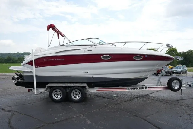 Slide: The Image of 2008 Crownline 250 CR boat on trailer, red and white design, parked outdoors. - 4