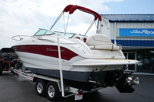 Slide: The Image of 2008 Crownline 250 CR boat on trailer, parked outside dealership. - 7