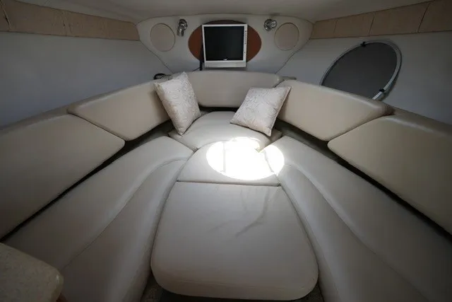 Slide: The Image of Interior of 2008 Crownline 250 CR boat with beige seating and pillows. - 17