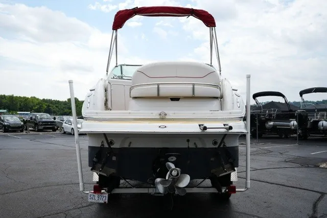 Slide: The Image of 2008 Crownline 250 CR boat, rear view, parked on a trailer in a lot. - 6