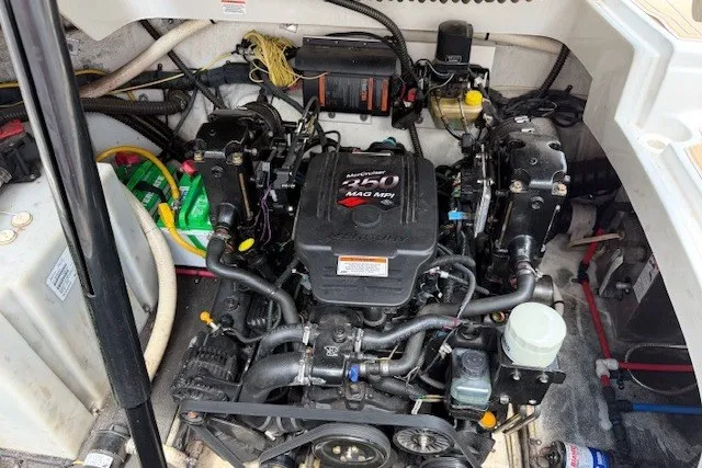 Slide: The Image of Engine compartment of a 2008 Crownline 250 CR boat, featuring a MerCruiser 350 MAG MPI engine. - 20