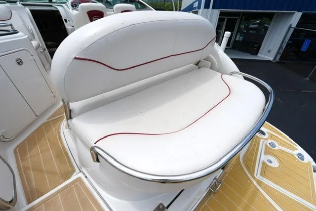 Slide: The Image of 2008 Crownline 250 CR boat with white cushioned seating and stainless steel railing. - 14
