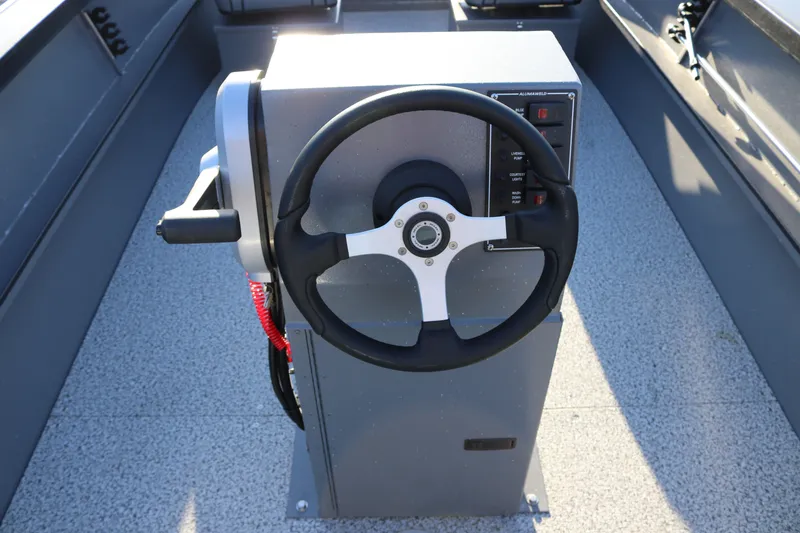 Slide: The Image of 2027 Alumaweld Adventurer 20 boat steering console with modern controls and sleek design. - 5